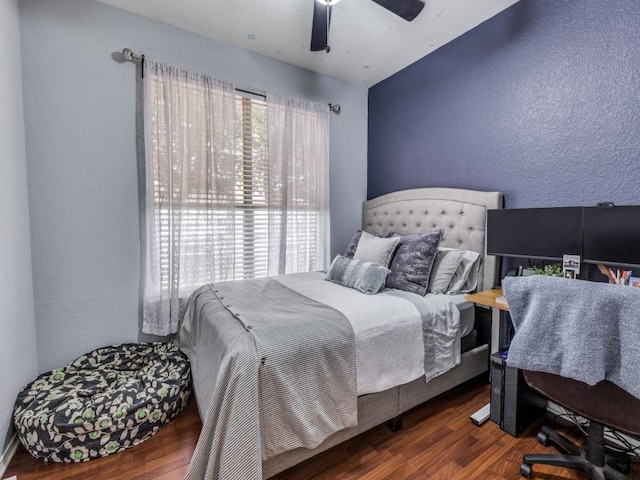 13320 Gilwell Dr, Del Valle, TX 78617 - bedroom featuring wood finished floors, a textured wall, and ceiling fan