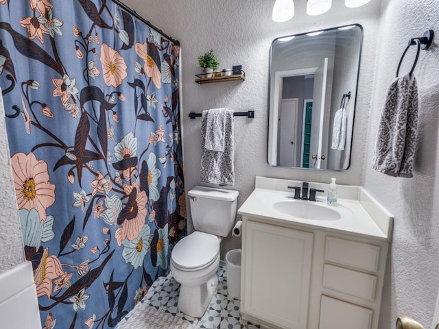 13320 Gilwell Dr, Del Valle, TX 78617 - bathroom featuring a textured wall, vanity, and curtained shower