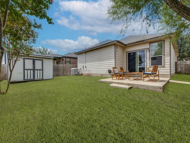 13320 Gilwell Dr, Del Valle, TX 78617 - back of property with a fenced backyard, a shed, and a patio area