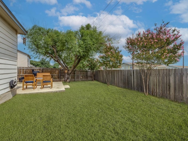 13320 Gilwell Dr, Del Valle, TX 78617 - fenced backyard featuring a patio