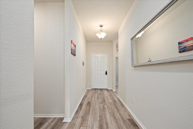 212 Gunther Way, Taylor, TX 76574 - hall with wood finished floors and a textured wall