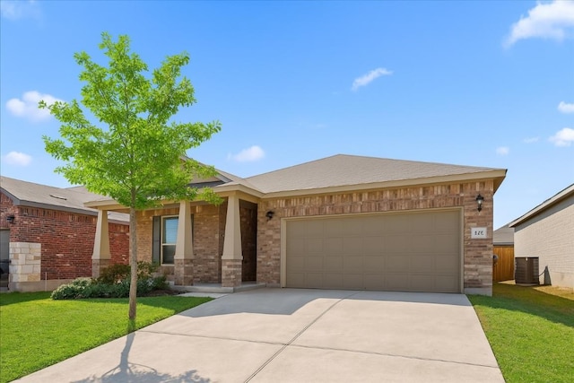212 Gunther Way, Taylor, TX 76574 - ranch-style home with brick siding, a front lawn, driveway, a garage, and a porch