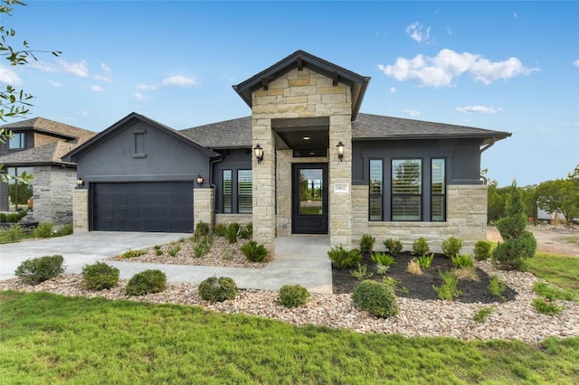 19617 Serenity Ln, Lago Vista, TX 78645 - view of front facade with stone siding, a garage, concrete driveway, and roof with shingles