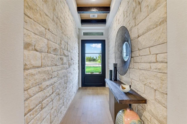 19617 Serenity Ln, Lago Vista, TX 78645 - doorway to outside featuring wood finished floors and a tray ceiling