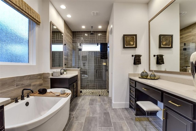 19617 Serenity Ln, Lago Vista, TX 78645 - full bathroom featuring a shower stall, vanity, a freestanding tub, and recessed lighting