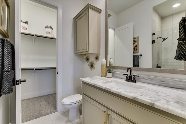 19617 Serenity Ln, Lago Vista, TX 78645 - full bathroom featuring vanity, tile patterned floors, a spacious closet, tiled shower, and recessed lighting