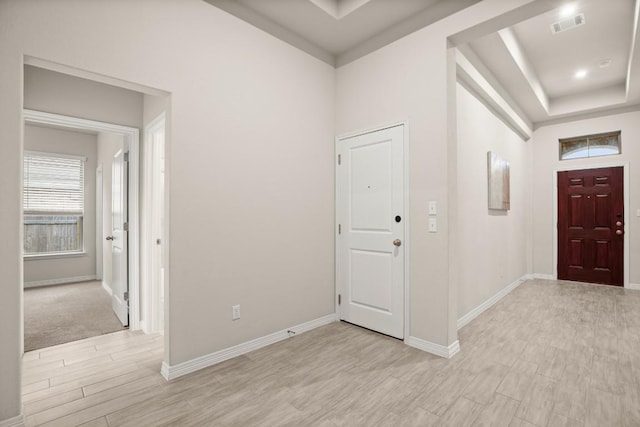 1921 Sauterne Dr, Leander, TX 78641 - entryway with light wood-style floors and a tray ceiling