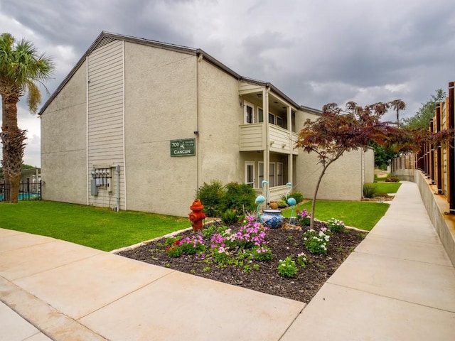 604 Highcrest Dr Unit 722, Granite Shoals, TX 78654 - view of home's exterior with stucco siding and a balcony