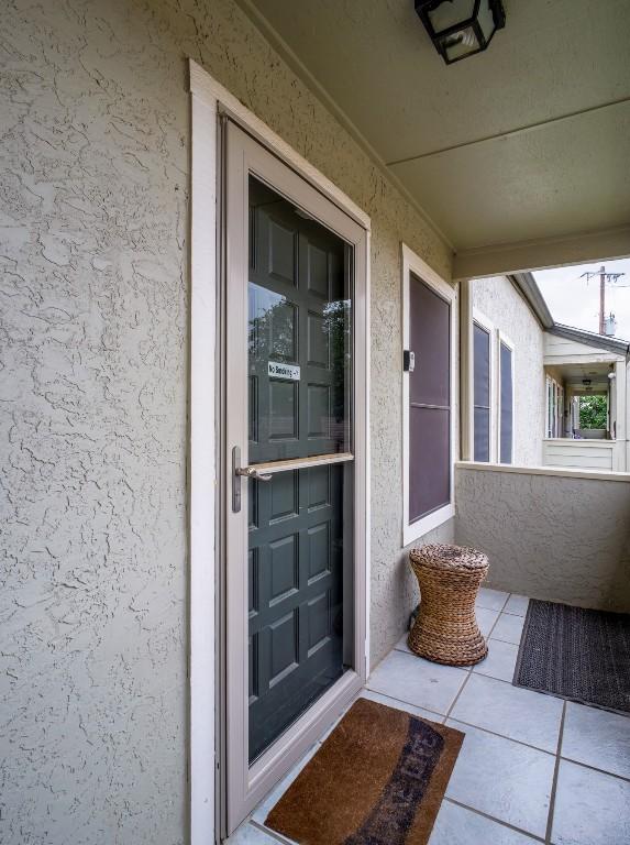 604 Highcrest Dr Unit 722, Granite Shoals, TX 78654 - entrance to property featuring stucco siding and a balcony