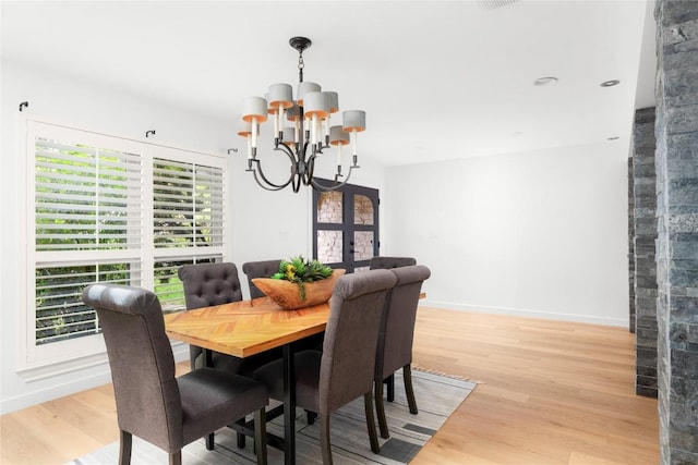 9309 Cedar Forest Dr, Austin, TX 78750 - dining room featuring a chandelier, light wood-style flooring, and french doors