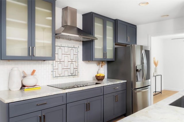 9309 Cedar Forest Dr, Austin, TX 78750 - kitchen with wall chimney exhaust hood, black electric stovetop, backsplash, and stainless steel fridge with ice dispenser