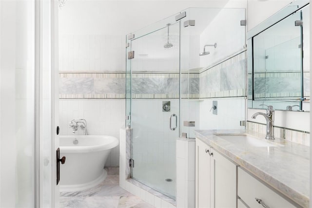 9309 Cedar Forest Dr, Austin, TX 78750 - bathroom featuring a shower stall, vanity, a freestanding bath, and marble finish floors