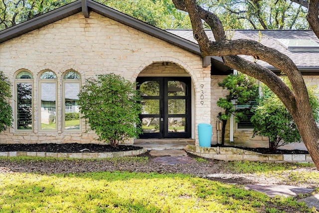 9309 Cedar Forest Dr, Austin, TX 78750 - entrance to property featuring stone siding and french doors