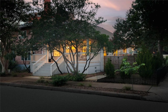 1018 Shelley Ave, Austin, TX 78703 - view of property hidden behind natural elements featuring stairs and a porch