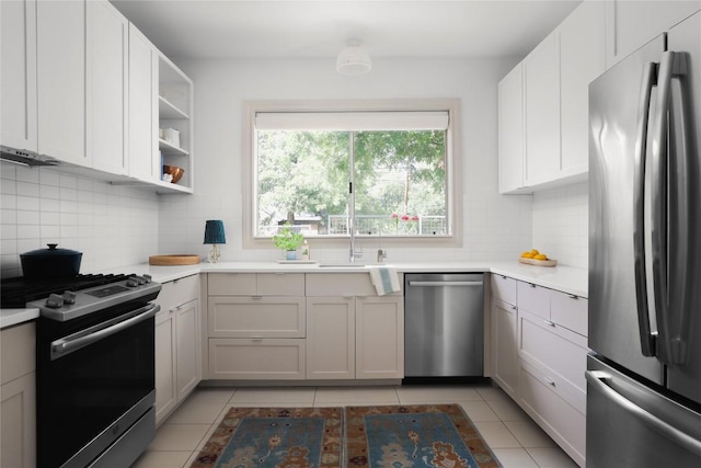 1018 Shelley Ave, Austin, TX 78703 - kitchen featuring appliances with stainless steel finishes, tasteful backsplash, light countertops, and light tile patterned flooring