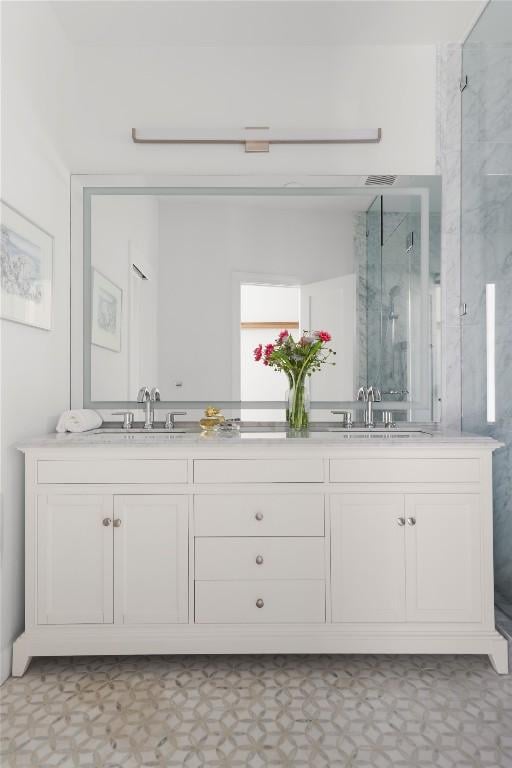 1018 Shelley Ave, Austin, TX 78703 - full bath featuring double vanity, a stall shower, and tile patterned floors
