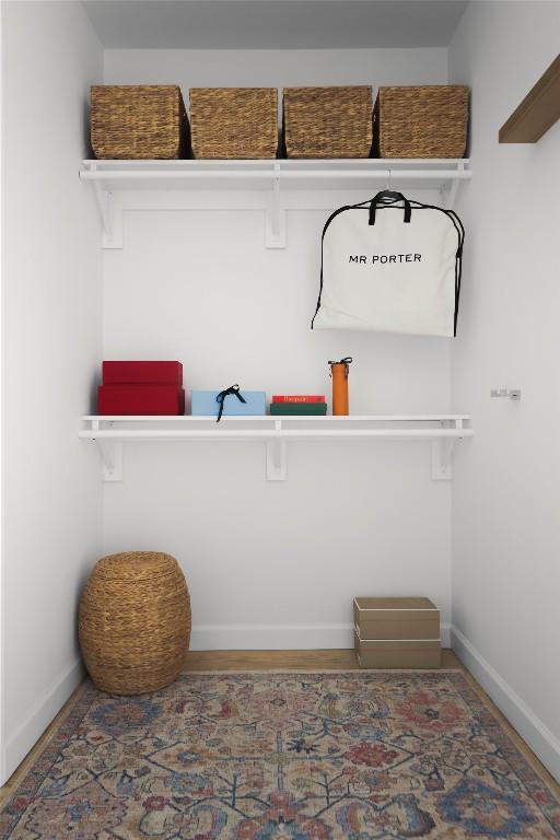 1018 Shelley Ave, Austin, TX 78703 - mudroom with baseboards and wood finished floors
