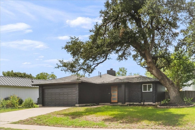 3803 Alexandria Dr, Austin, TX 78749 - view of front facade with an attached garage, a front yard, concrete driveway, and a chimney