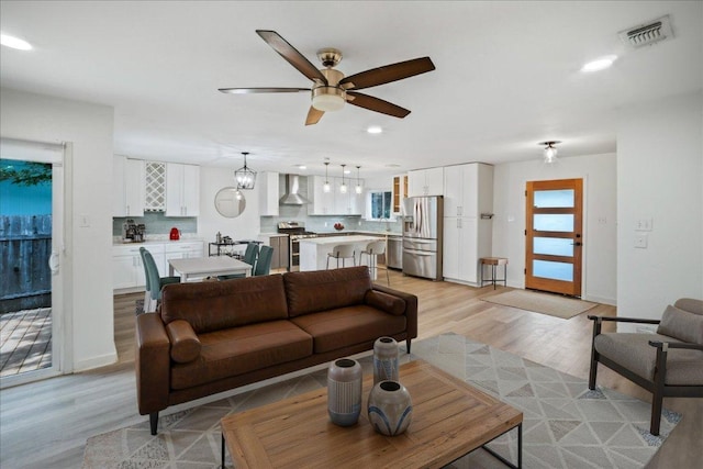 3803 Alexandria Dr, Austin, TX 78749 - living room with a ceiling fan, recessed lighting, and light wood finished floors