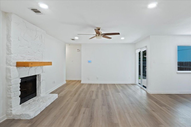 3803 Alexandria Dr, Austin, TX 78749 - unfurnished living room featuring a ceiling fan, light wood finished floors, a fireplace, and recessed lighting