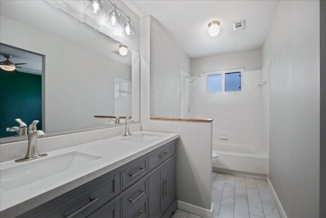 3803 Alexandria Dr, Austin, TX 78749 - bathroom featuring double vanity,  shower combination, marble look tiles, and a ceiling fan