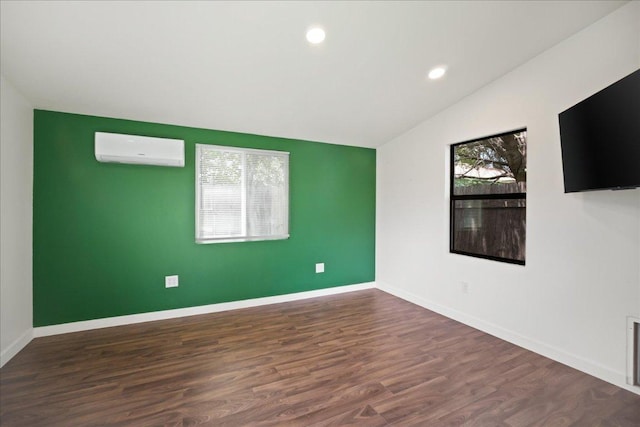 3803 Alexandria Dr, Austin, TX 78749 - unfurnished room with a wall mounted AC, lofted ceiling, dark wood-style floors, and recessed lighting