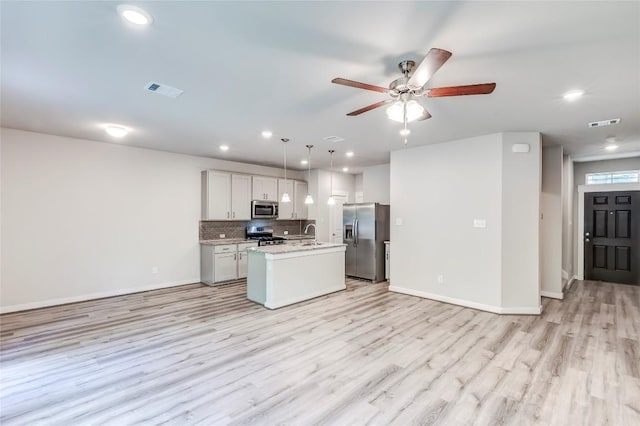 17200C Crane Fly Dr Unit C, Pflugerville, TX 78660 - kitchen with stainless steel appliances, open floor plan, light wood-style flooring, and recessed lighting