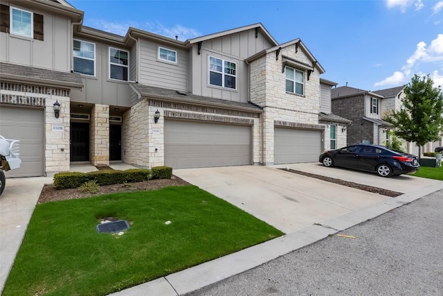 17200C Crane Fly Dr Unit C, Pflugerville, TX 78660 - craftsman house with board and batten siding, stone siding, a garage, and concrete driveway