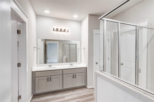 17200C Crane Fly Dr Unit C, Pflugerville, TX 78660 - full bath featuring a stall shower, double vanity, and wood finished floors