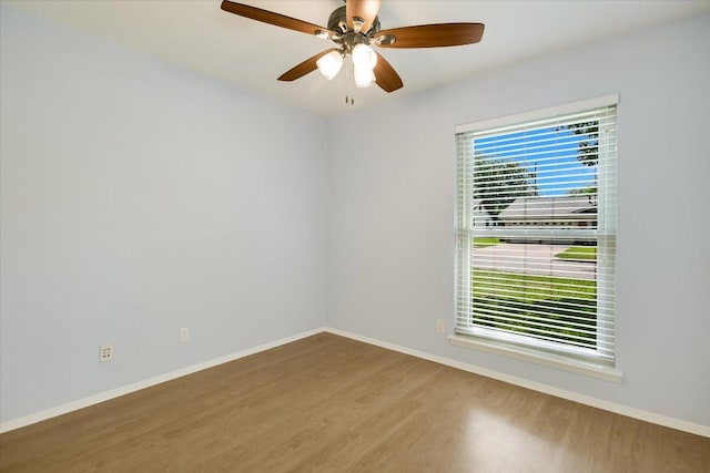 8012 Stillwood Ln, Austin, TX 78757 - unfurnished room featuring wood finished floors and ceiling fan
