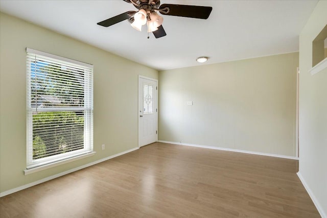 8012 Stillwood Ln, Austin, TX 78757 - spare room with light wood finished floors and a ceiling fan