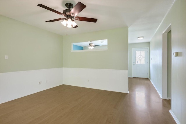 8012 Stillwood Ln, Austin, TX 78757 - empty room with wood finished floors and ceiling fan