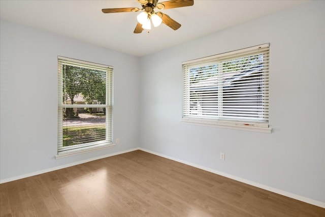 8012 Stillwood Ln, Austin, TX 78757 - spare room with plenty of natural light, wood finished floors, and a ceiling fan