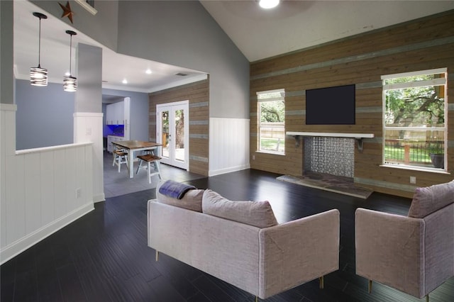 607 County Cork Ln, Leander, TX 78641 - living area with wainscoting, french doors, wooden walls, recessed lighting, and wood finished floors