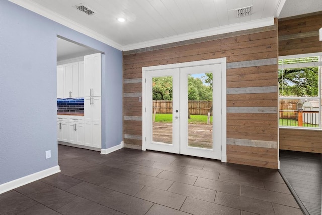 607 County Cork Ln, Leander, TX 78641 - entryway with french doors, ornamental molding, wooden walls, recessed lighting, and dark tile patterned flooring