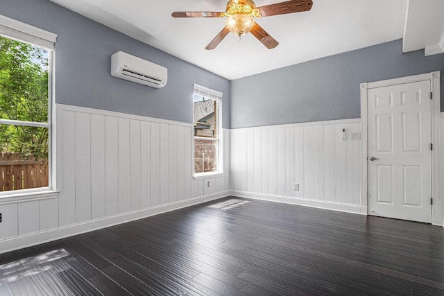 607 County Cork Ln, Leander, TX 78641 - unfurnished room featuring a wall mounted AC, wainscoting, dark wood-style floors, and ceiling fan