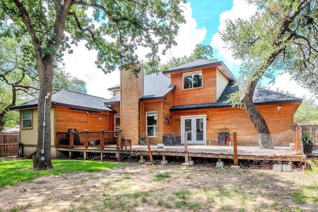 607 County Cork Ln, Leander, TX 78641 - rear view of house with french doors, a deck, a chimney, and a shingled roof