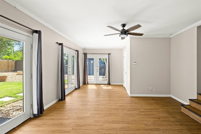 2301 Westworth Cir, Austin, TX 78704 - unfurnished room featuring healthy amount of natural light, french doors, light wood finished floors, and ornamental molding