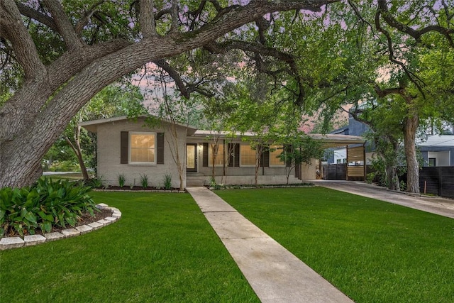 2301 Westworth Cir, Austin, TX 78704 - single story home with a front yard, driveway, and a carport