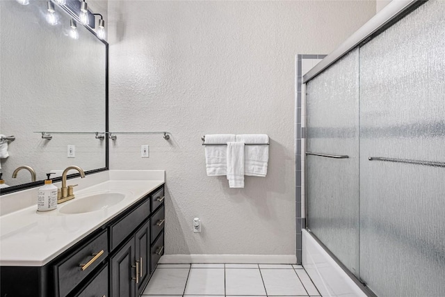 220 Meadow Oaks Dr, Dripping Springs, TX 78620 - bathroom featuring vanity, tile patterned floors, and shower / bath combination with glass door