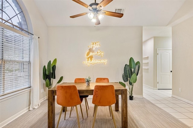 220 Meadow Oaks Dr, Dripping Springs, TX 78620 - tiled dining area featuring healthy amount of natural light, a chandelier, and a ceiling fan