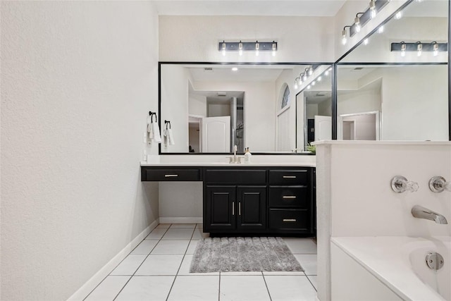 220 Meadow Oaks Dr, Dripping Springs, TX 78620 - bathroom with a tub, vanity, and tile patterned floors