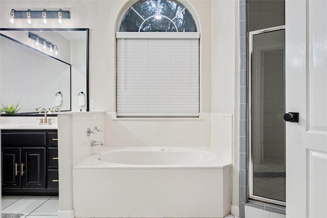 220 Meadow Oaks Dr, Dripping Springs, TX 78620 - bathroom featuring a garden tub, vanity, a shower stall, and tile patterned flooring