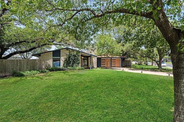 2601 Ashdale Dr, Austin, TX 78757 - view of yard with a garage and driveway