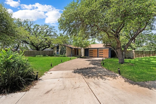 2601 Ashdale Dr, Austin, TX 78757 - mid-century home with a garage and concrete driveway