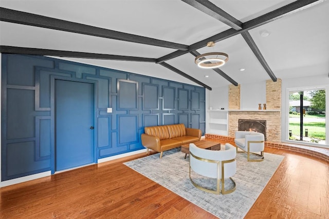 2601 Ashdale Dr, Austin, TX 78757 - living area with wood finished floors and a stone fireplace