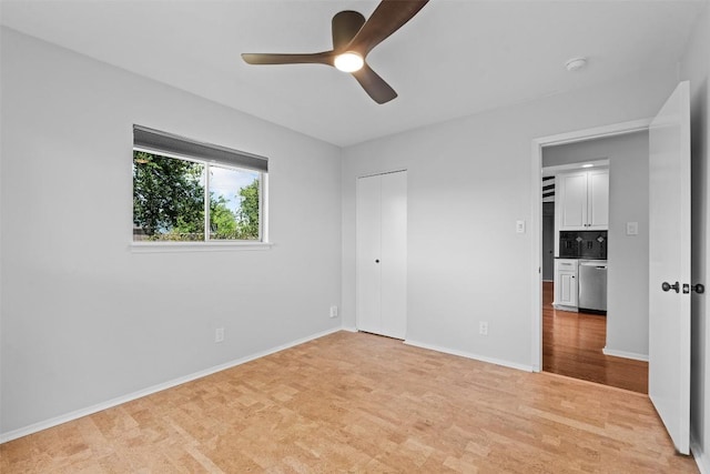 2601 Ashdale Dr, Austin, TX 78757 - unfurnished bedroom featuring light wood-type flooring, a ceiling fan, and a closet