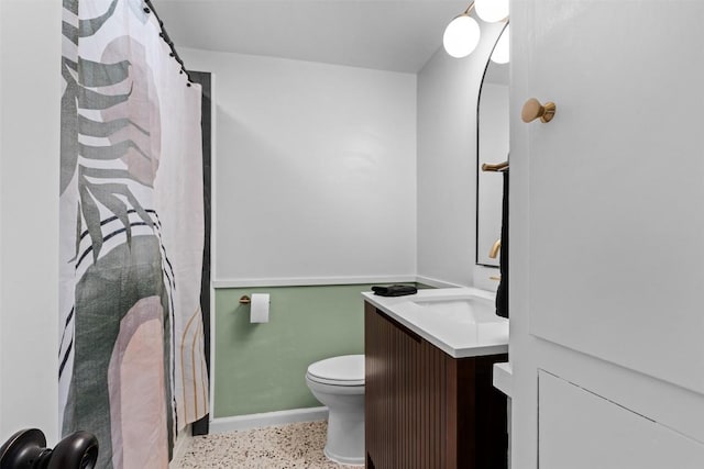 2601 Ashdale Dr, Austin, TX 78757 - bathroom with vanity, speckled floor, and a shower with shower curtain