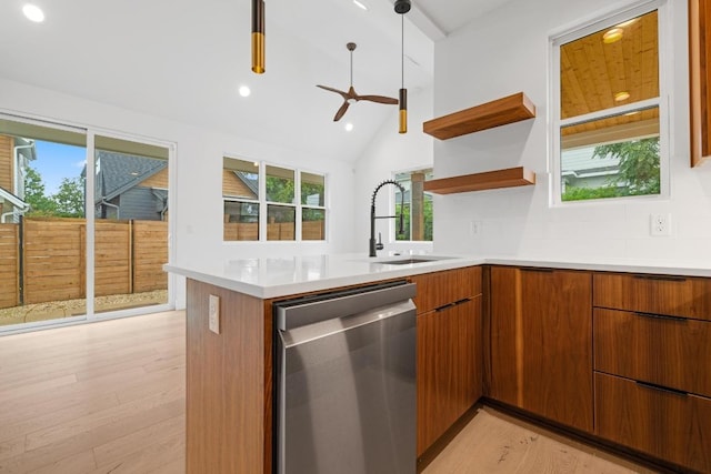 7706 Watson St Unit 2, Austin, TX 78757 - kitchen with dishwasher, modern cabinets, light wood-style flooring, a peninsula, and recessed lighting