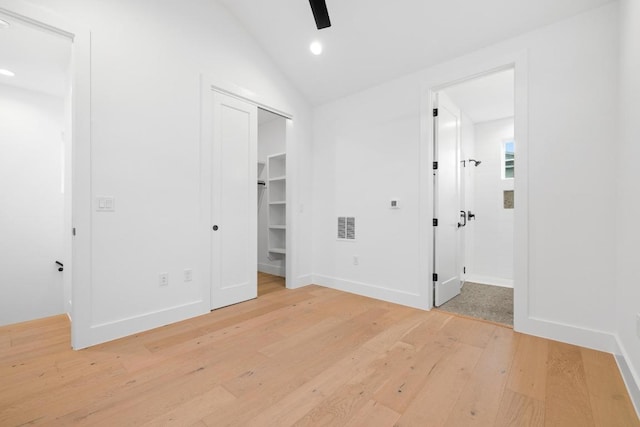 7706 Watson St Unit 2, Austin, TX 78757 - unfurnished bedroom with light wood-type flooring, lofted ceiling, recessed lighting, ensuite bathroom, and ceiling fan